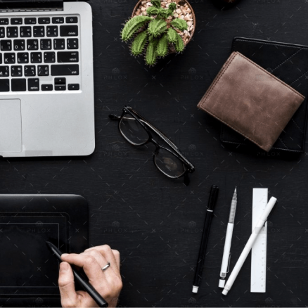 demo-attachment-1564-aerial-view-of-hands-working-with-computer-laptop-PCD9TQ7@2x